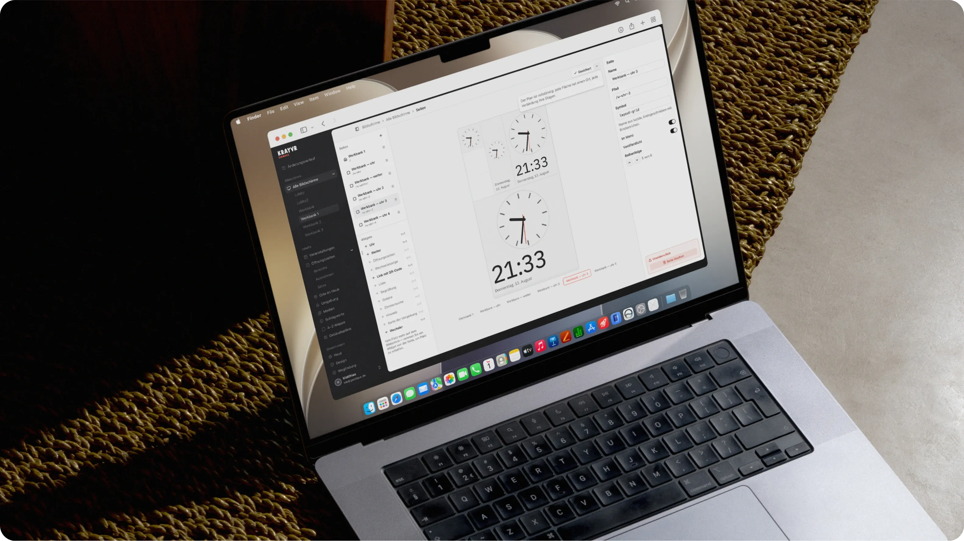 The Krayvr editor open on a laptop, a clock widget being arranged on a screen's page