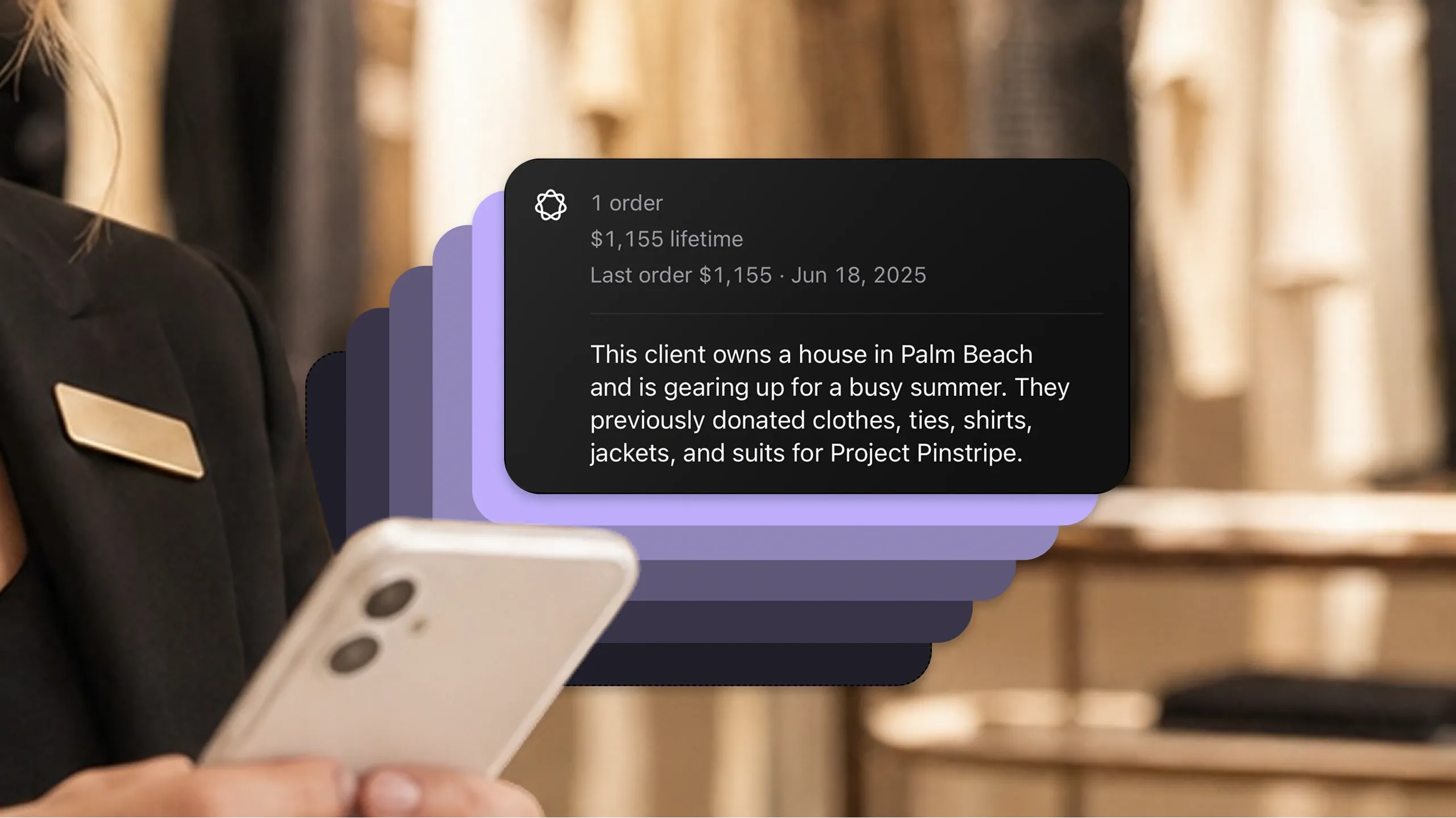An associate on the shop floor holding a phone, a client's history fanned out beside it - lifetime spend, last order, and a note about what they buy